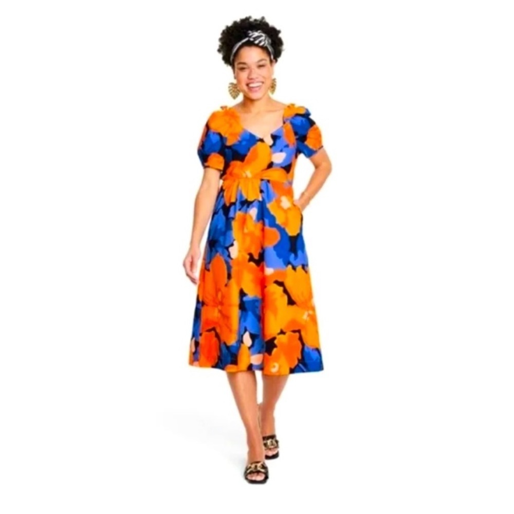 Tabitha Brown puff sleeve orange blue tie back midi dress.
